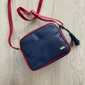Bolso manos libres azul con rojo en cuero